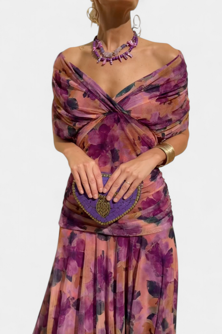 Feminine off-shoulder floral maxi dress with elegant sweetheart neckline and ruched accents.