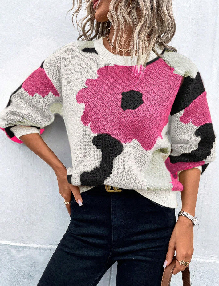 Soft knit women's pullover sweater featuring an eye-catching floral print
