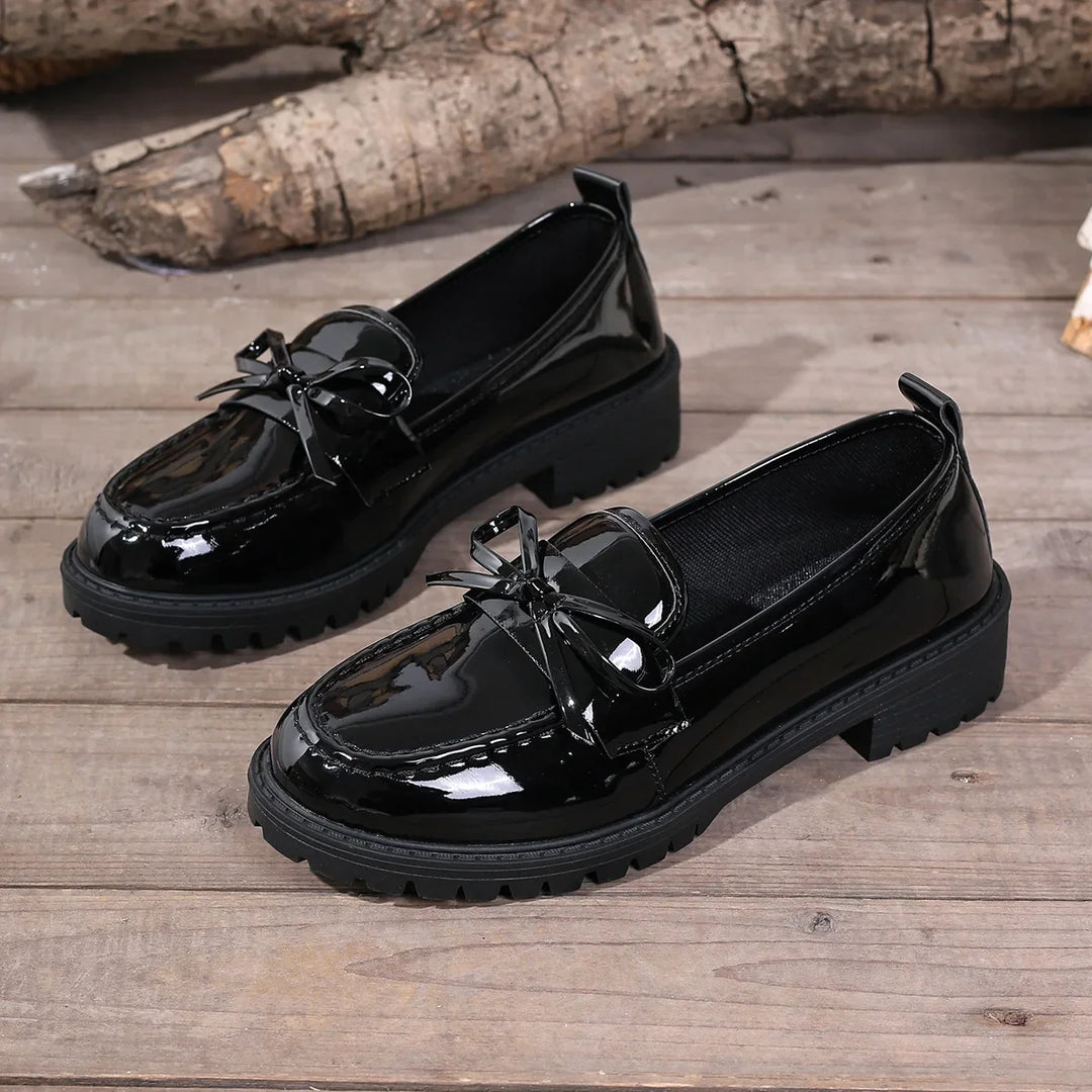 Understated elegance: women's patent leather loafers, perfect for a chic look
