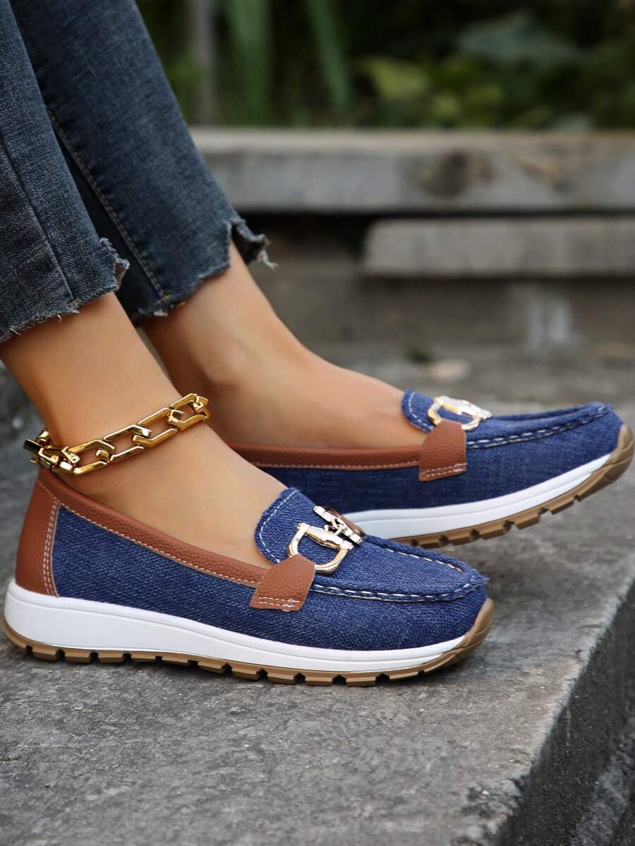 Stylish women's loafers with gold horsebit trim, offering all-day comfort and a sleek look.