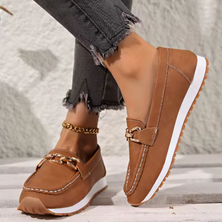 Women's slip-on loafers featuring gold horsebit accent, rounded toe for comfort.