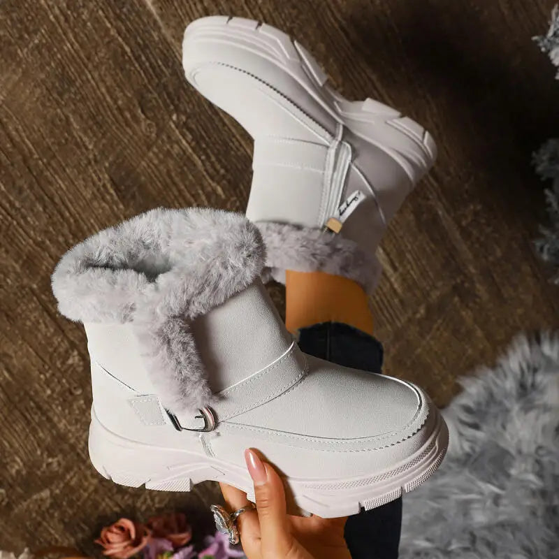 Model wearing women's gray faux fur buckle boots, showcasing a winter outfit