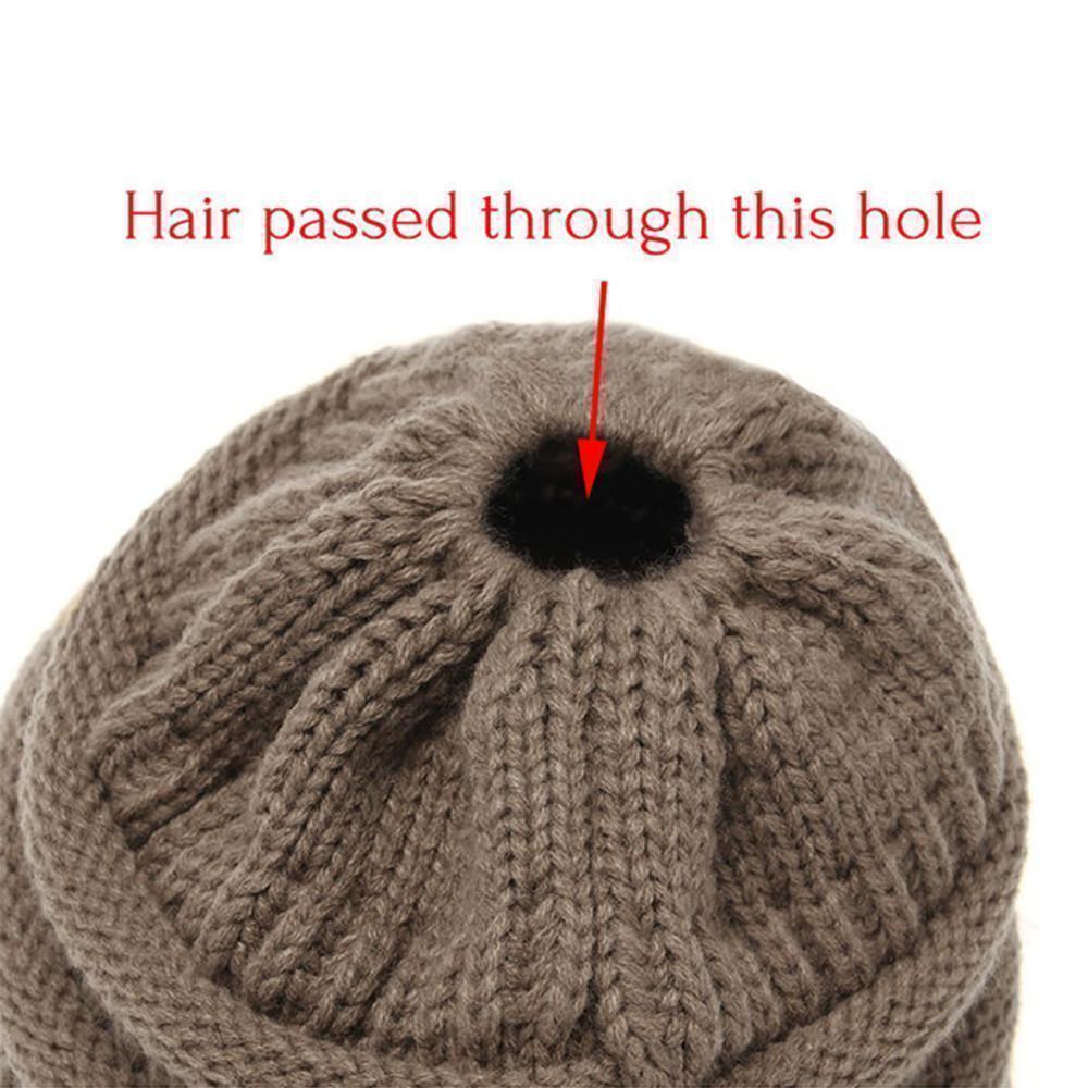 Overhead view of a Women's Knit Ponytail Beanie, emphasizing its cozy and warm feel