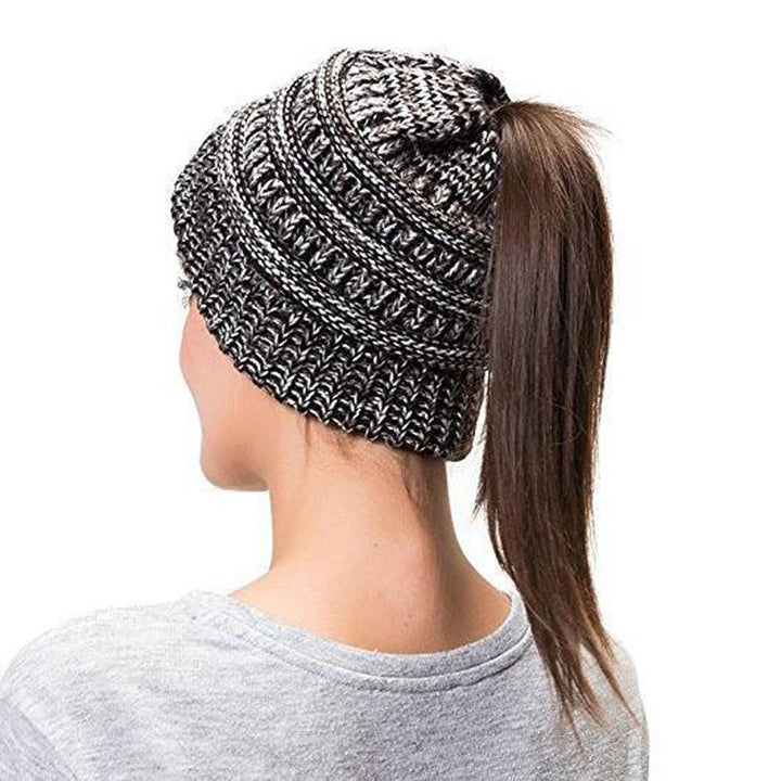 Fashionable Women's Knit Beanie Hat in a vibrant color, featuring a convenient ponytail slot