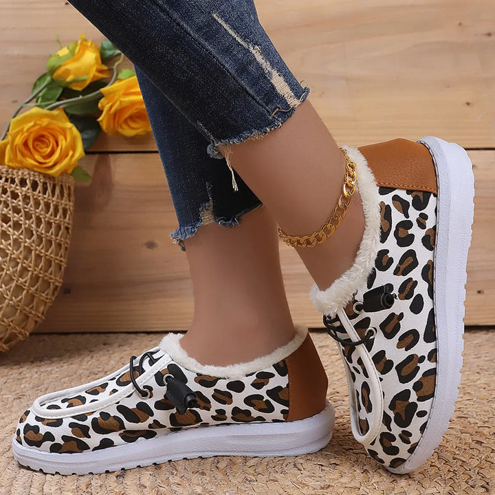Side view of women's comfortable leopard print lace-up footwear, ideal for casual walks.