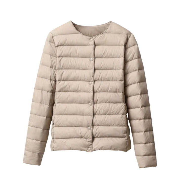 Close-up of the quilting detail on a women's lightweight spring puffer, highlighting the texture.