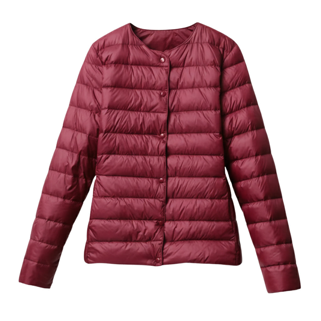 Model posing in a versatile women's lightweight puffer, ideal as a seasonal fashion jacket.