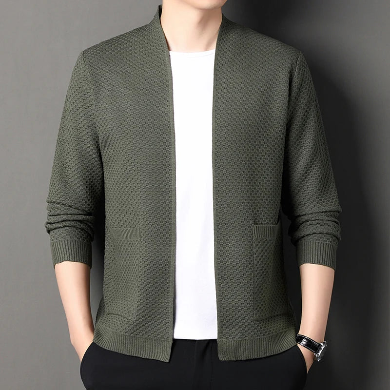 Folded women's knit cardigan ready for travel, emphasizing its midweight and layering appeal.