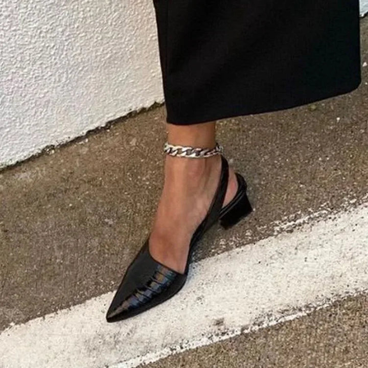 Elegant women's block heels featuring a pointed toe and slingback design for stylish all-day comfort. Fashionable.