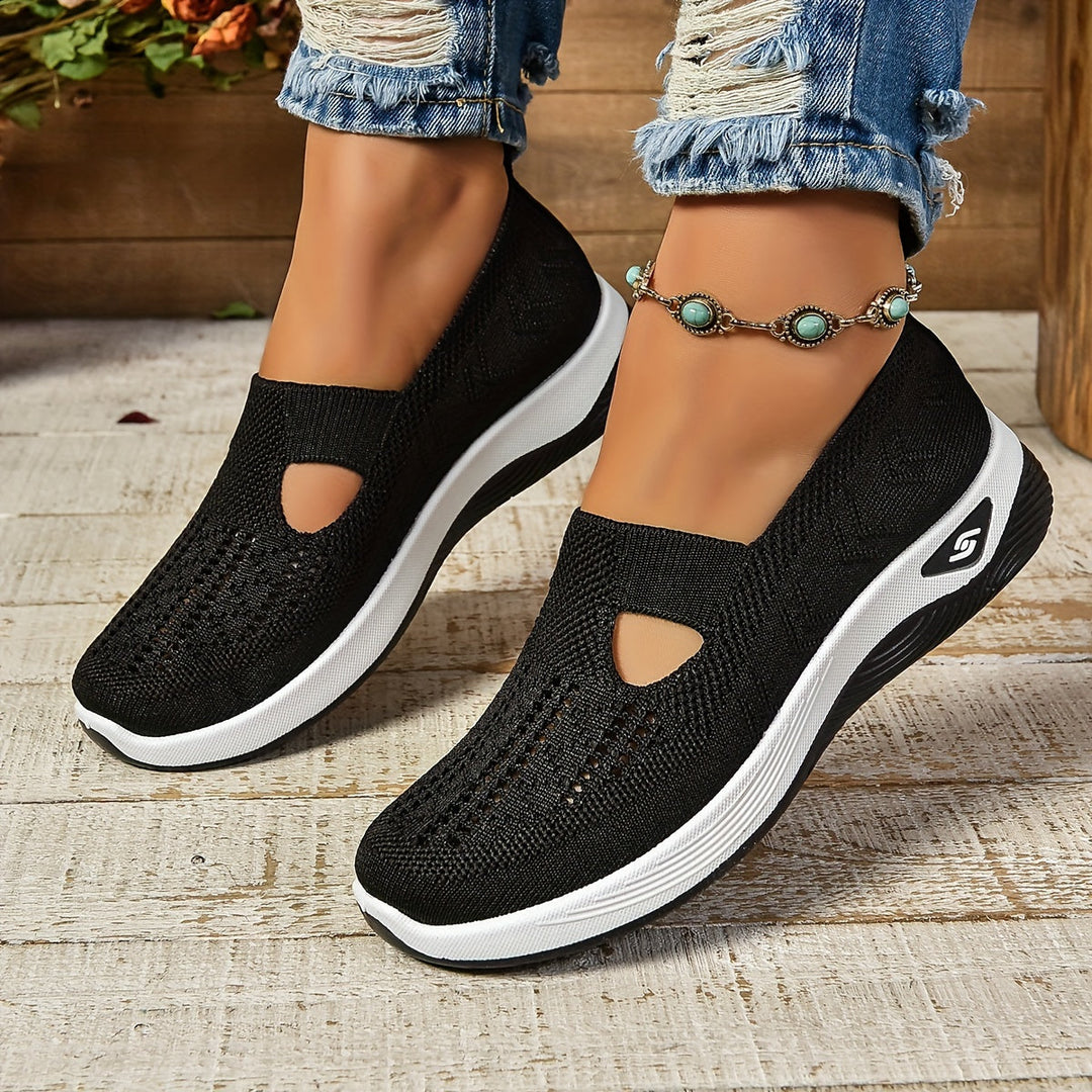 View of women's orthopedic slip-on walking shoes, highlighting cushioned arch support and comfort.
