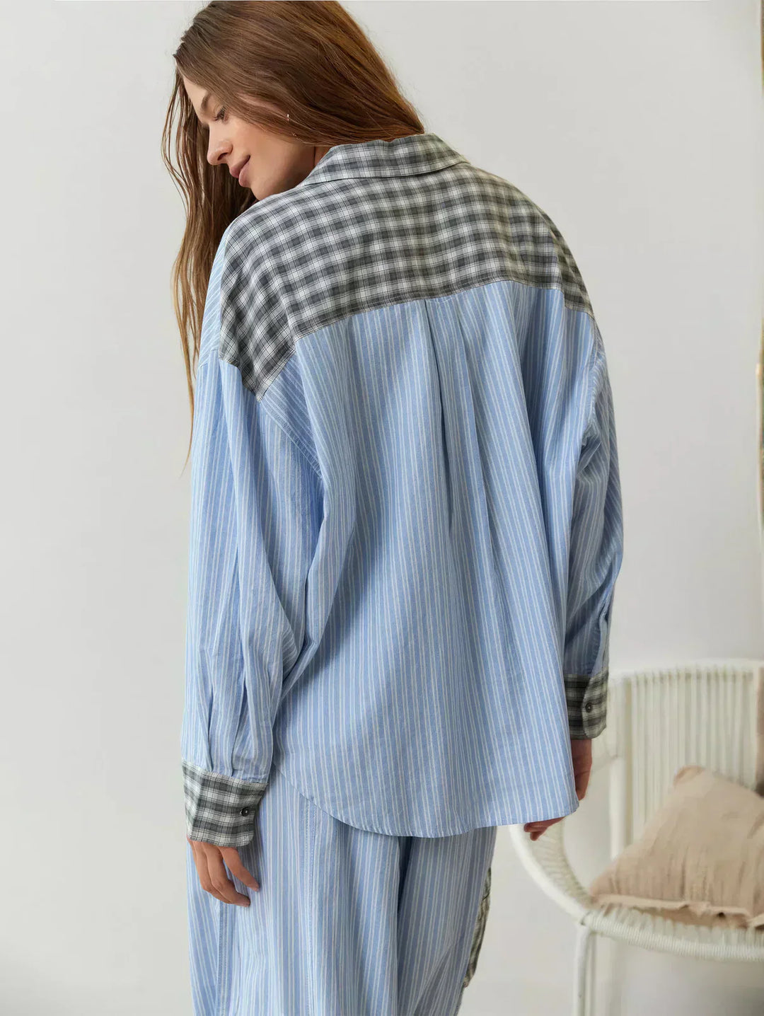 Detail shot of the top from the women's blue plaid two-piece set, displaying collar and button