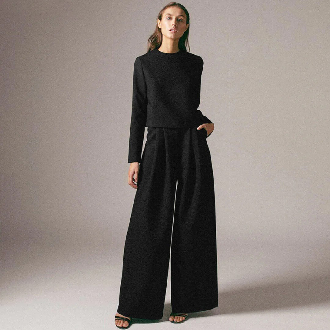Lightweight women's two-piece lounge wear featuring a stylish cropped top and flowy wide-leg pants.