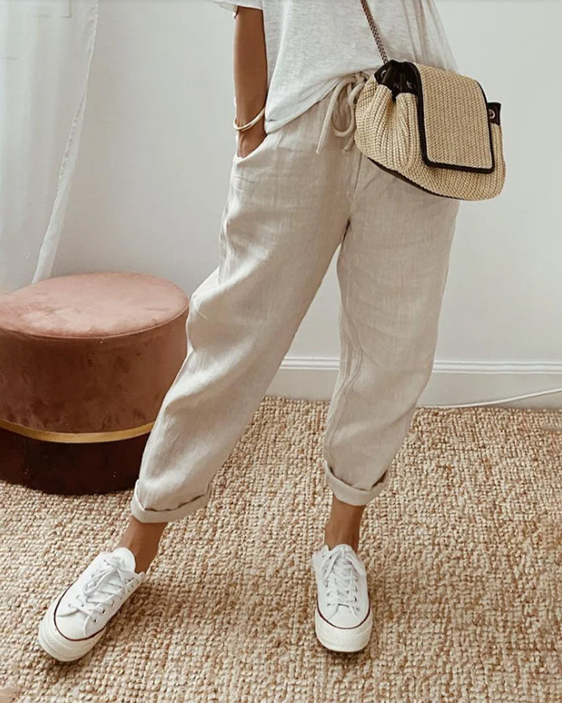 Women's relaxed fit linen joggers with comfortable drawstring waist, perfect for casual summer wear.