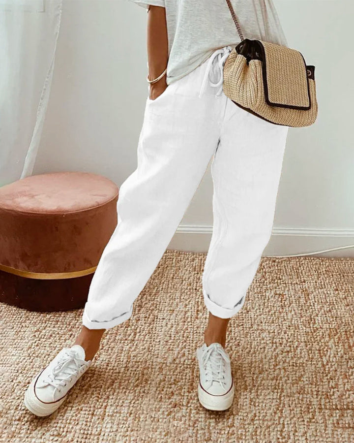 Lightweight women's linen joggers with a relaxed silhouette and adjustable drawstring waistband for all-day comfort.