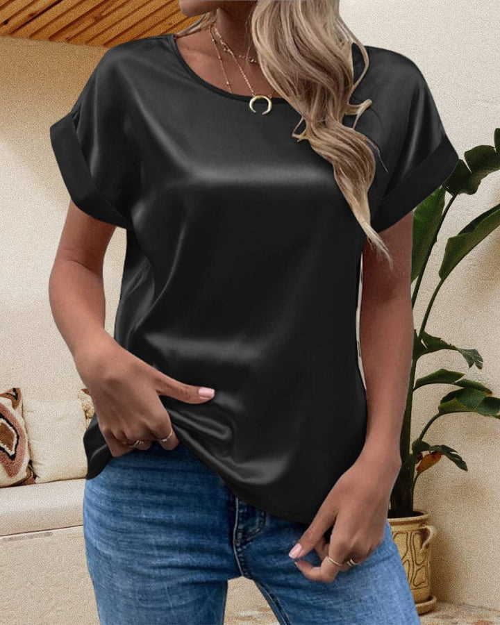 Relaxed fit women's satin top with short sleeves, luxurious silk feel for an elegant look.