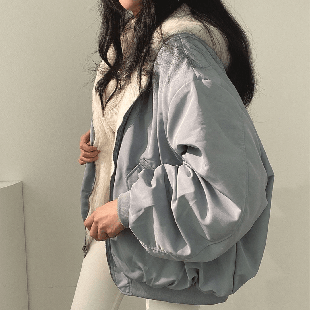 Women's relaxed fit winter jacket, forest green, back view, highlighting the spacious and cozy design.