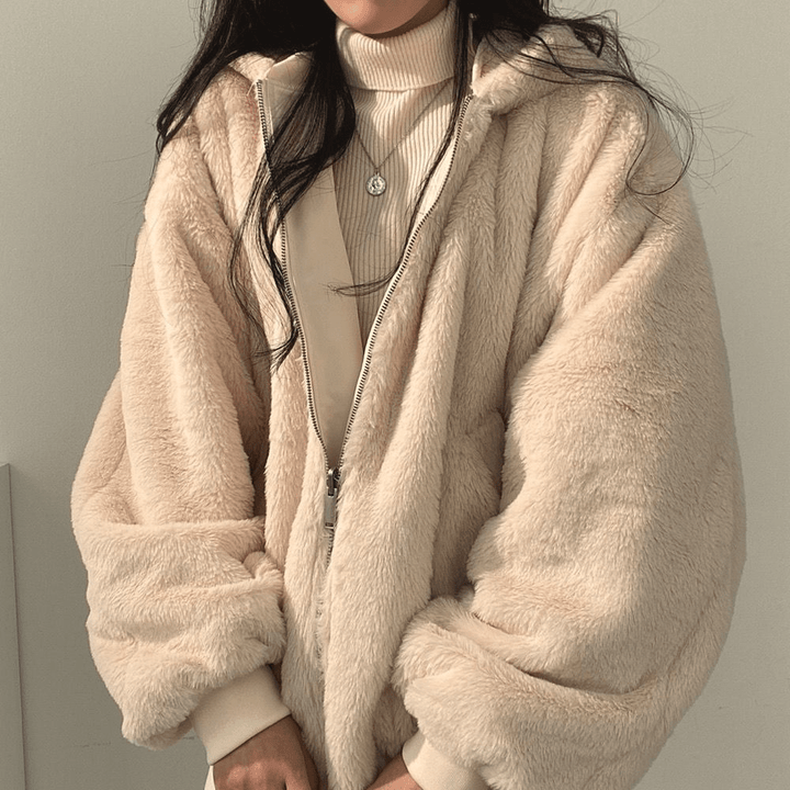 Women's cozy fashion winter jacket, cream white, spread flat to show the relaxed silhouette.