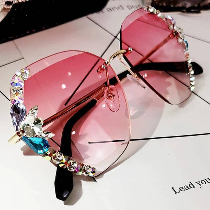 Fashionable rimless sunglasses with crystal detailing, offering UV400 protection