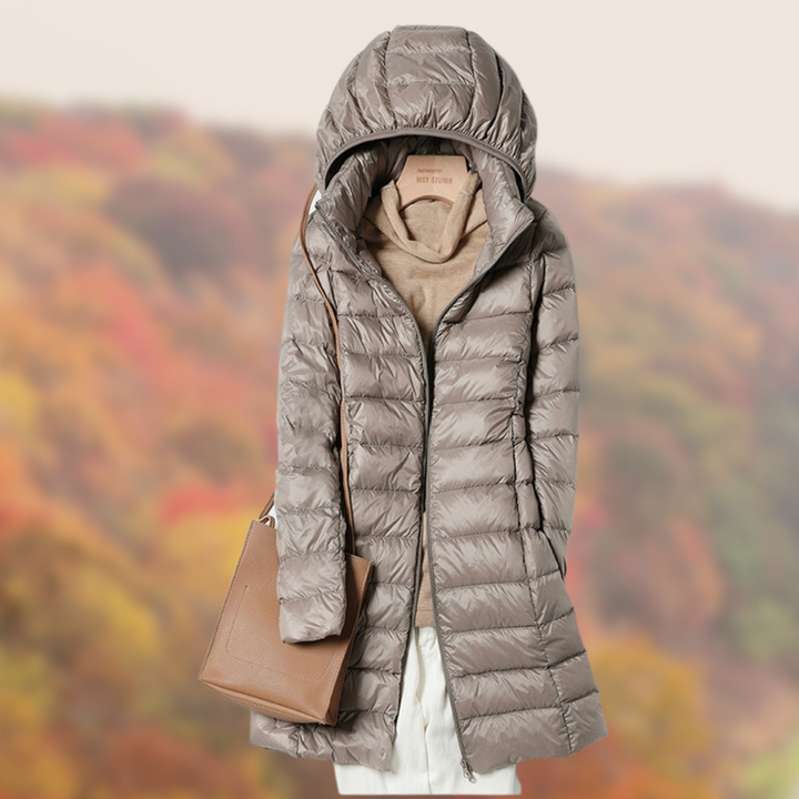 Close-up of a women's hooded puffer jacket, highlighting its warm and durable fabric