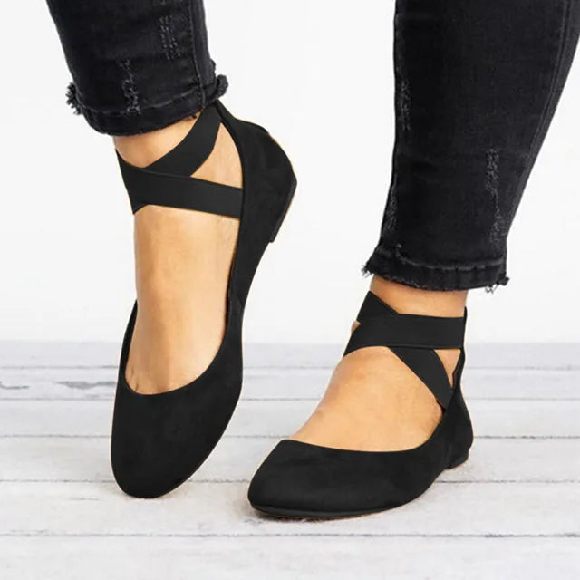 Close-up of women's spring cross-strap ballet flats, showcasing soft material and detailed strap design.
