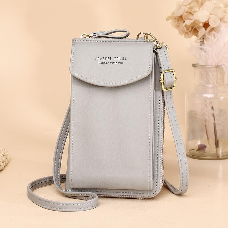 Interior of the women's crossbody wallet, with a lining pattern and multiple card slots