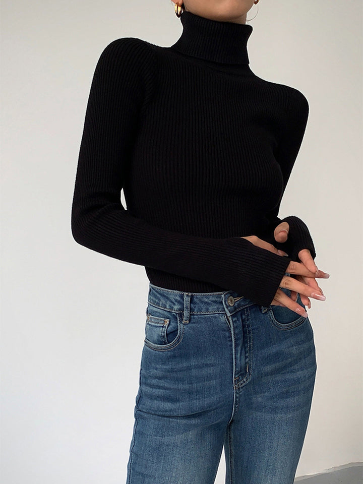 Women's comfortable ribbed turtleneck sweater in grey, an essential addition to any casual wardrobe.