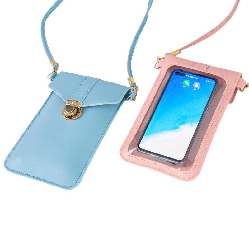 Lifestyle image of a woman using a touchscreen crossbody phone bag outdoors