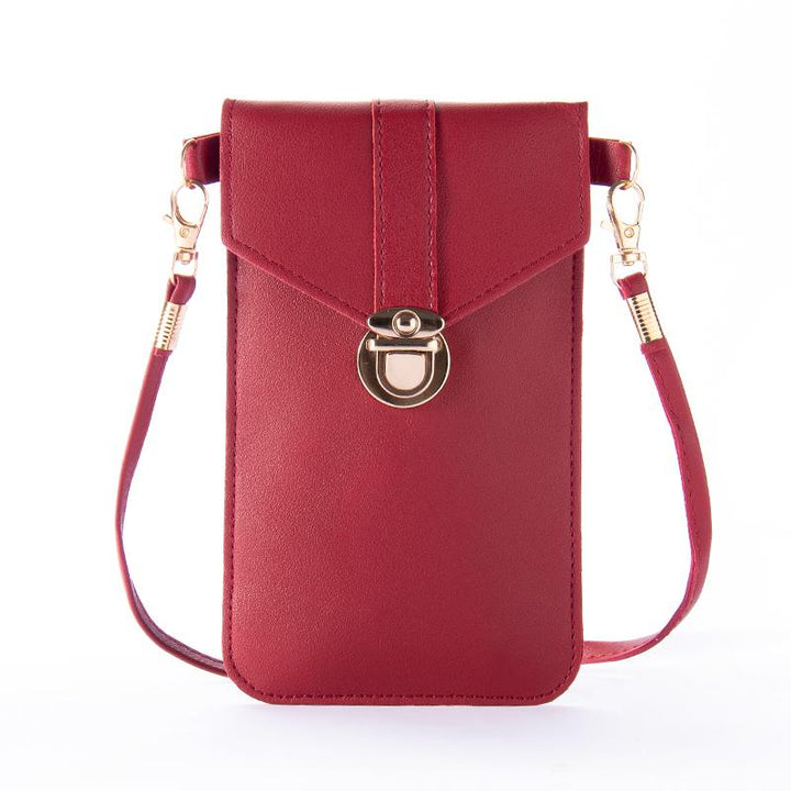 Hands-on image of a women's touchscreen crossbody phone bag, demonstrating screen access