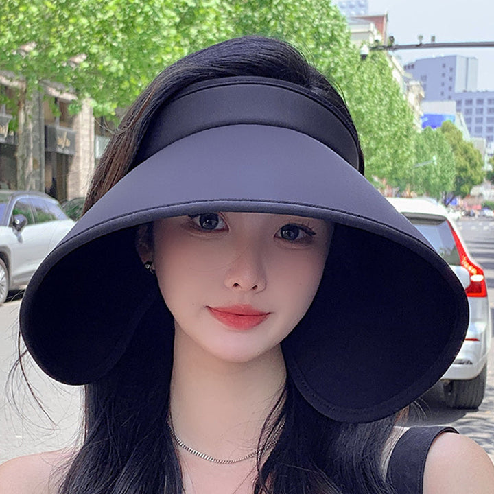 Women's hollow top sun hat, wide brim, UV protection, perfect for beach days & travel