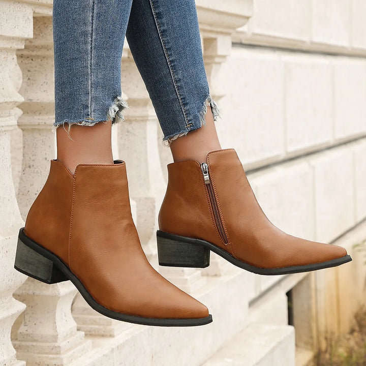 Verona women's black leather ankle boots featuring a sleek pointed toe and practical side zip.